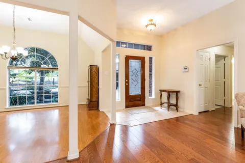 Entry foyer with wood flooring