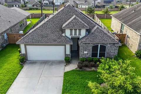 Drone view of the home and surrounding neighborhood