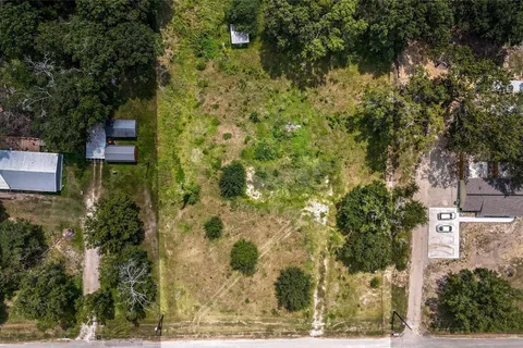 Wider aerial view showing the property's location near Dayton and I-10