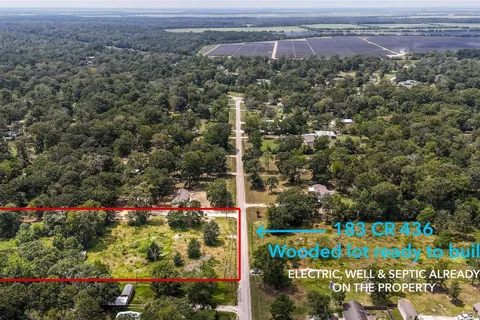Aerial view marking the property boundary — electric, well, and septic already on site
