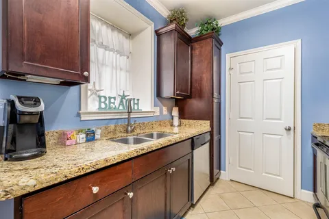 Full granite counters, wood cabinetry, stainless appliances