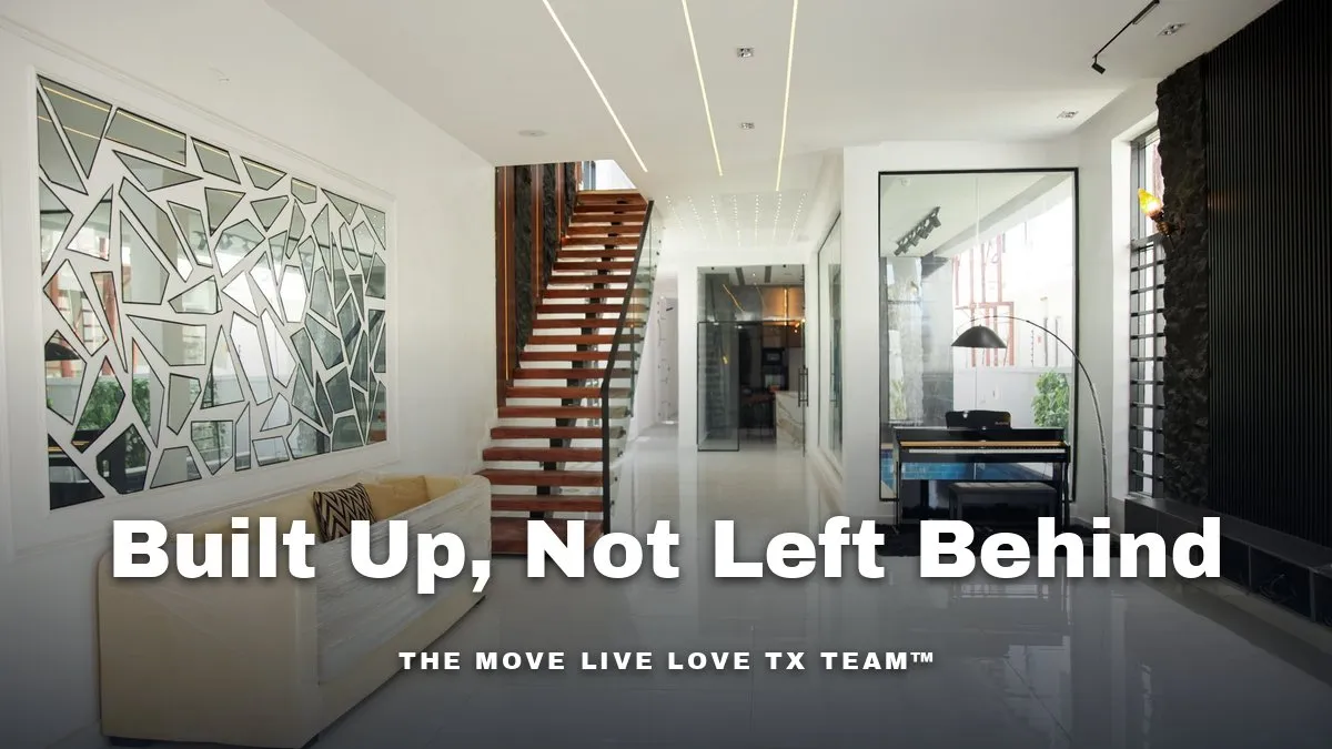 A bright, modern home interior staircase with a glass-enclosed residential elevator