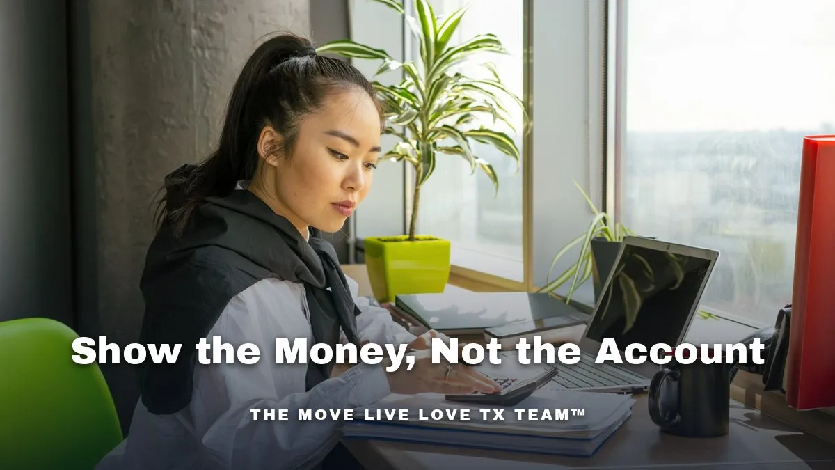Financial documents and a laptop on a desk beside a bright window