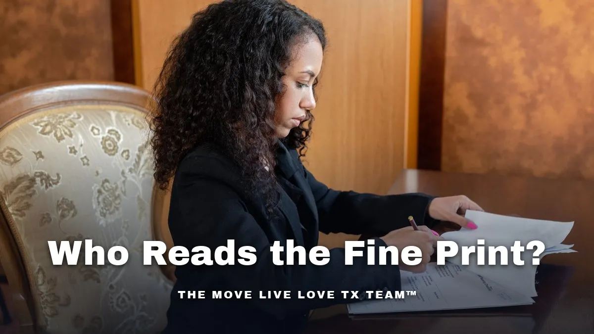An attorney in a dark suit reviewing and marking documents at a desk