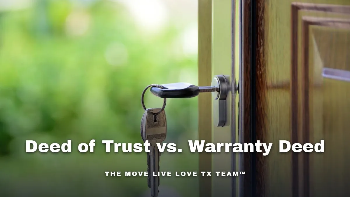 A key in the lock of a wooden front door with green trees blurred in the background