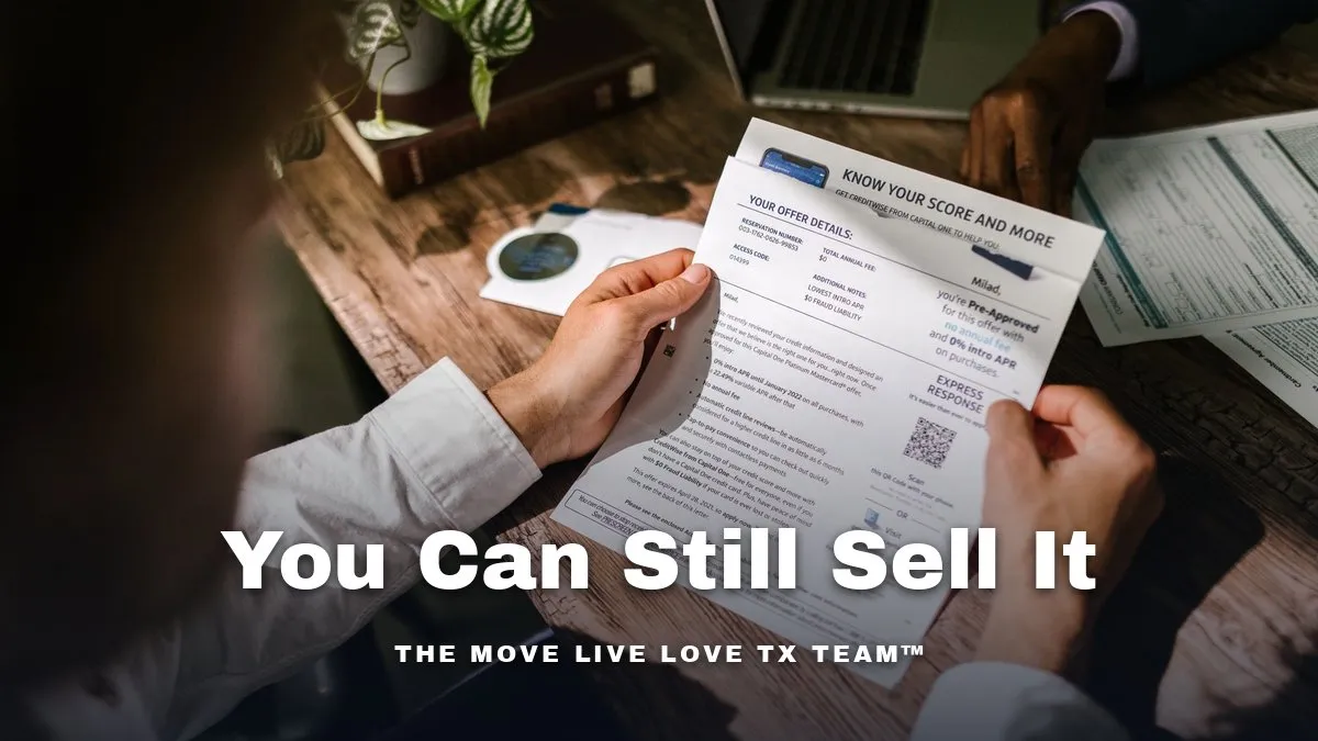 A couple reviewing closing paperwork together at a bright kitchen table