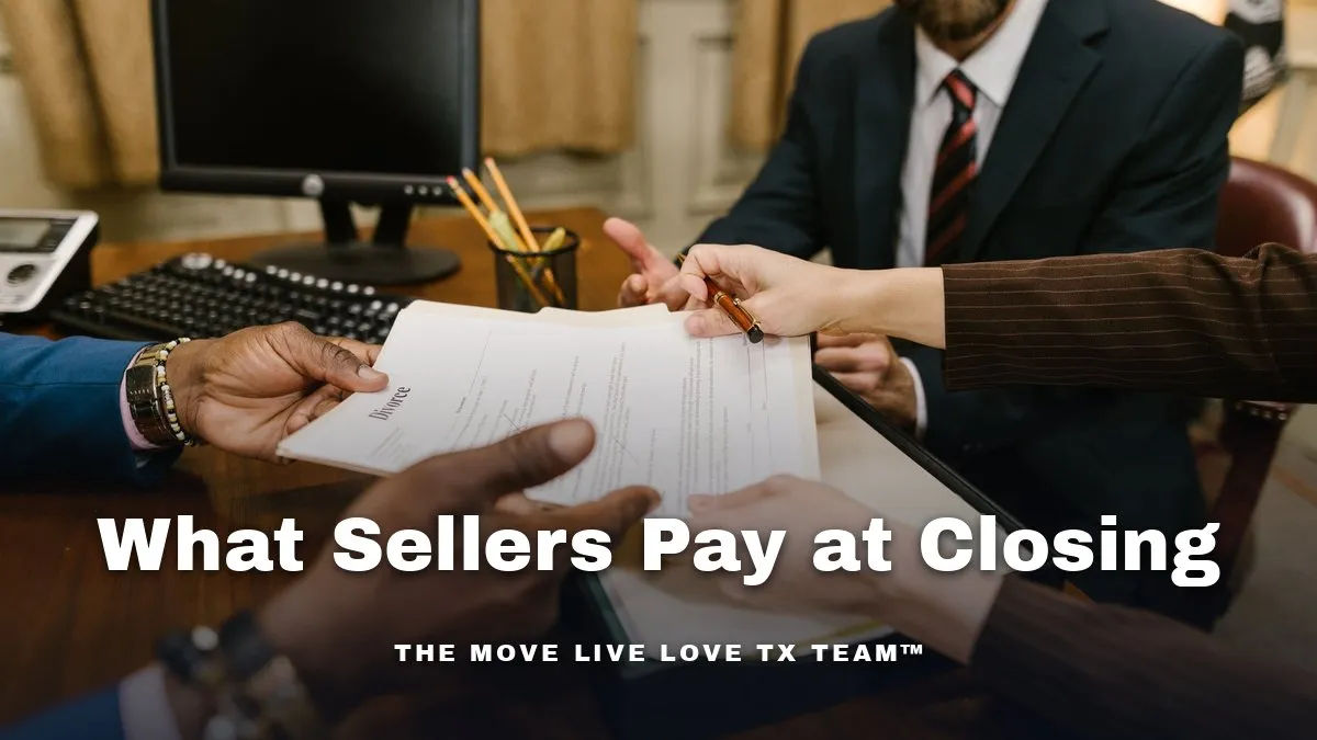 Hands signing a stack of papers at a desk in a bright office with daylight from a window