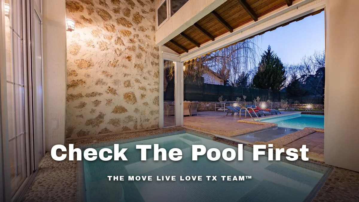 A backyard swimming pool with clear blue water and a covered patio in bright morning sunlight