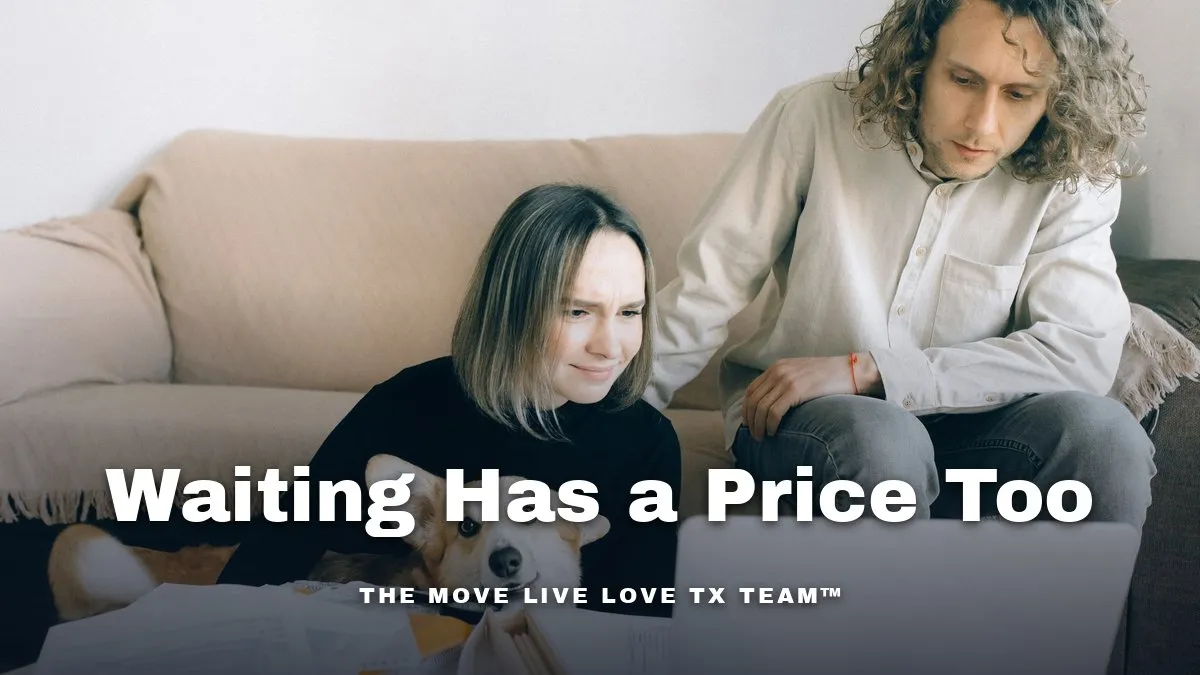 A couple sitting on the floor by a sofa looking over paperwork together