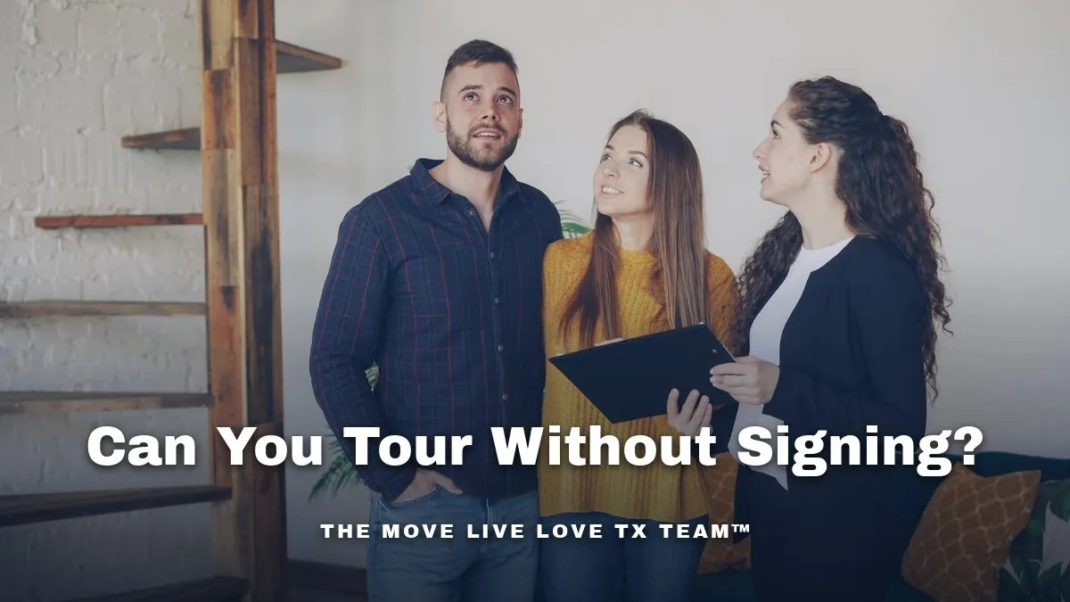 A couple looking around a home during a showing while a real estate agent beside them holds a folder of paperwork