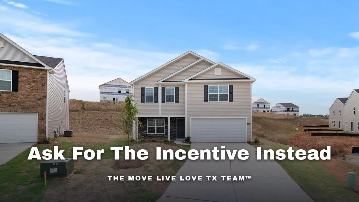 A newly built two-story home with a long driveway in a subdivision still under development