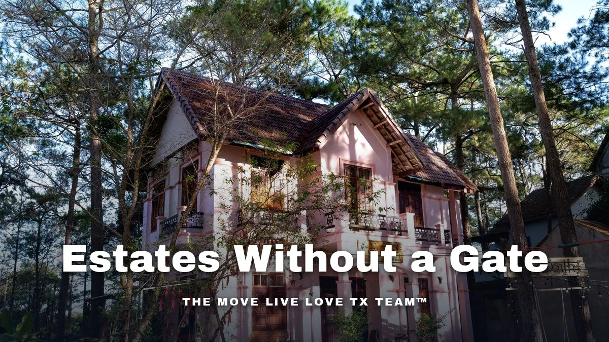 A large brick estate home shaded by mature pine trees on a quiet street