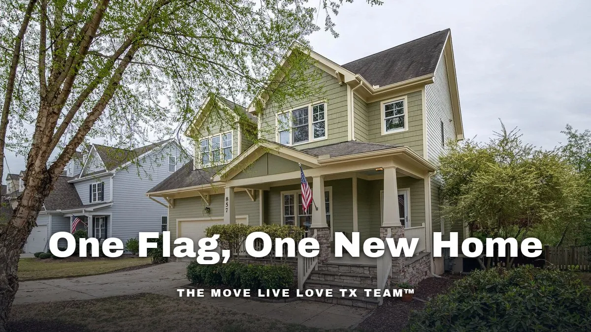 A two-story home with a covered front porch and an American flag by the steps