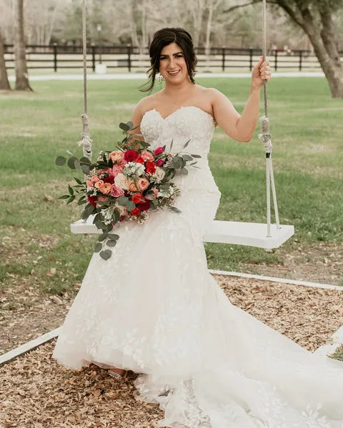 Bridal portrait on a flower swing
