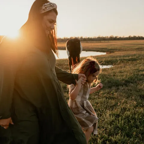 Mom and daughter at sunset